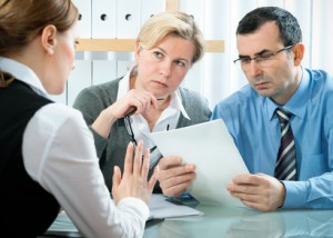 mid-adult couple meeting with financial planner
